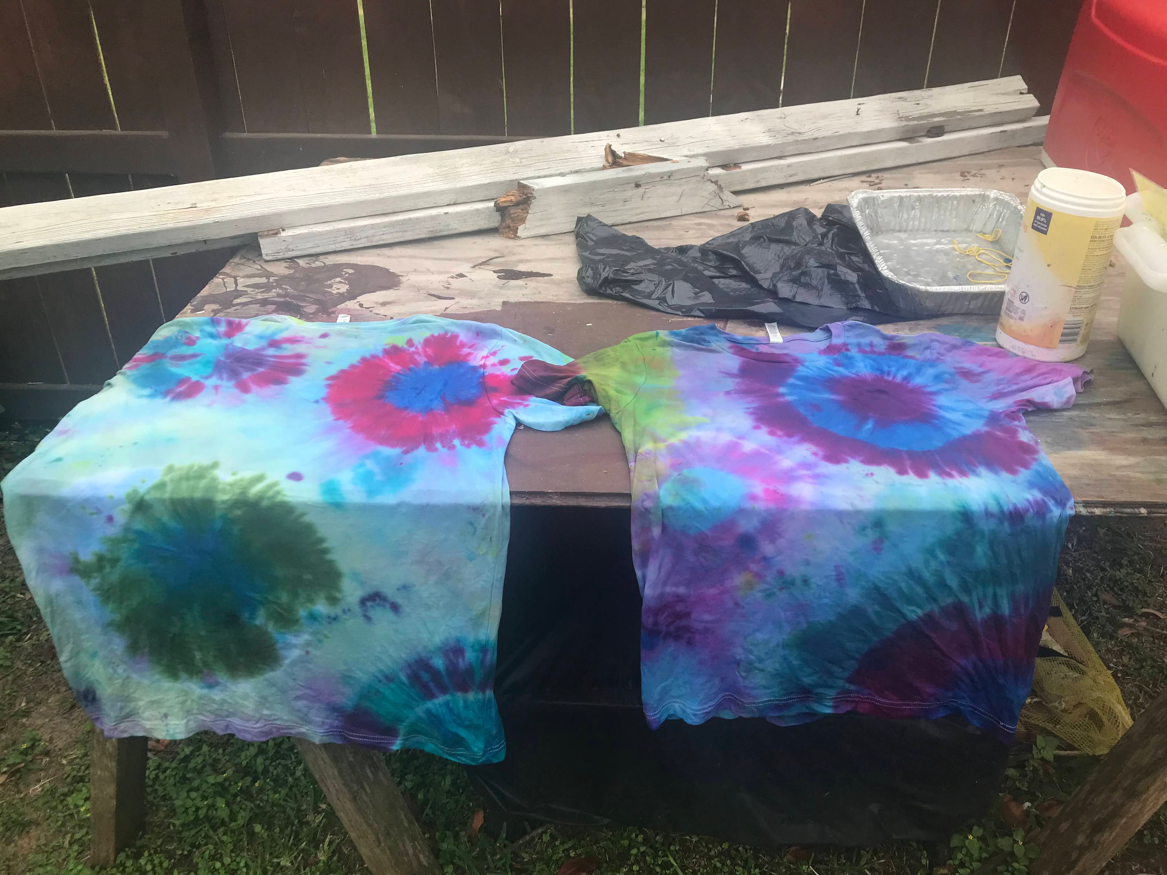 Vibrant finished tie-dye shirts laid out