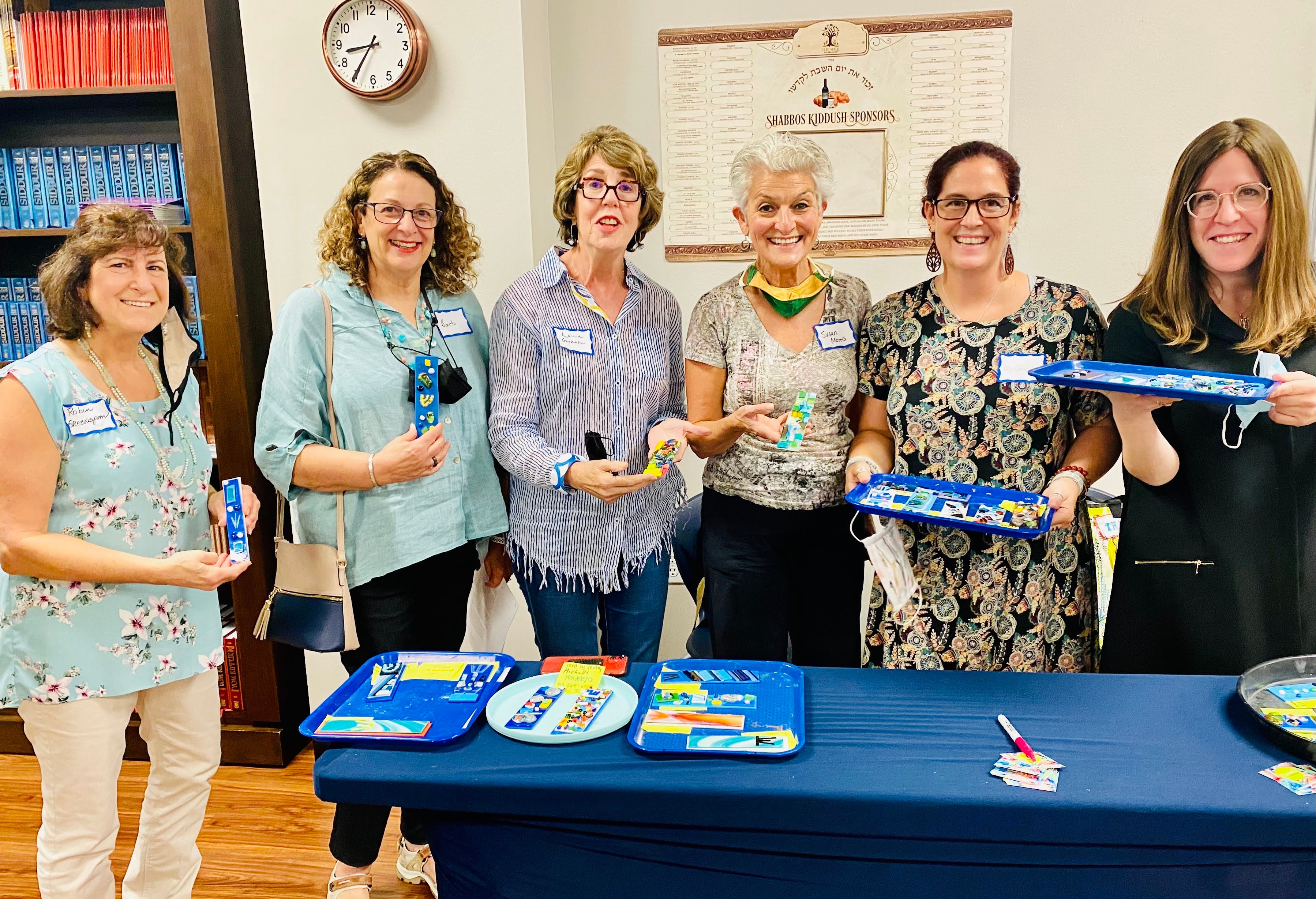Group glass art class with happy participants